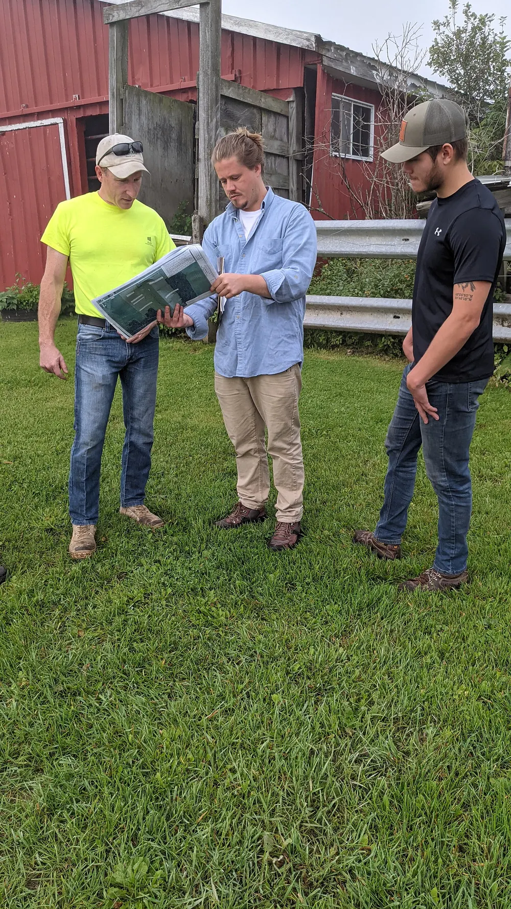 Architect and engineers meeting on site with drawings
